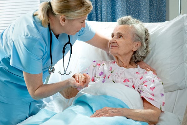 Nurse helping elderly at a nursing home